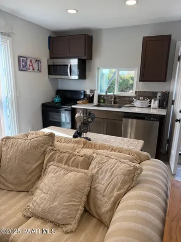 a bedroom with a large bed and a flat screen tv