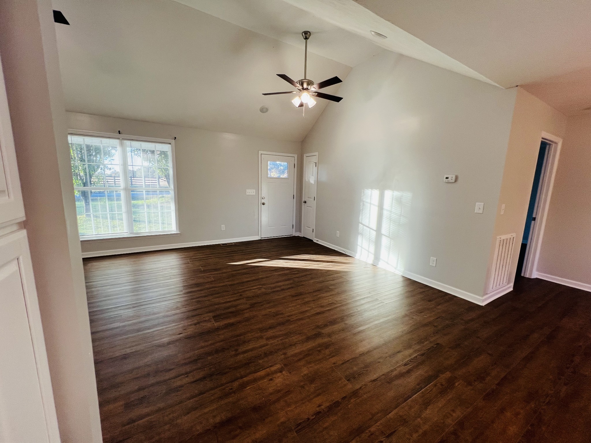 60 Myrick Road Flintville, TN 37335 - Photo 13 of 32 an empty room with wooden floor and windows
