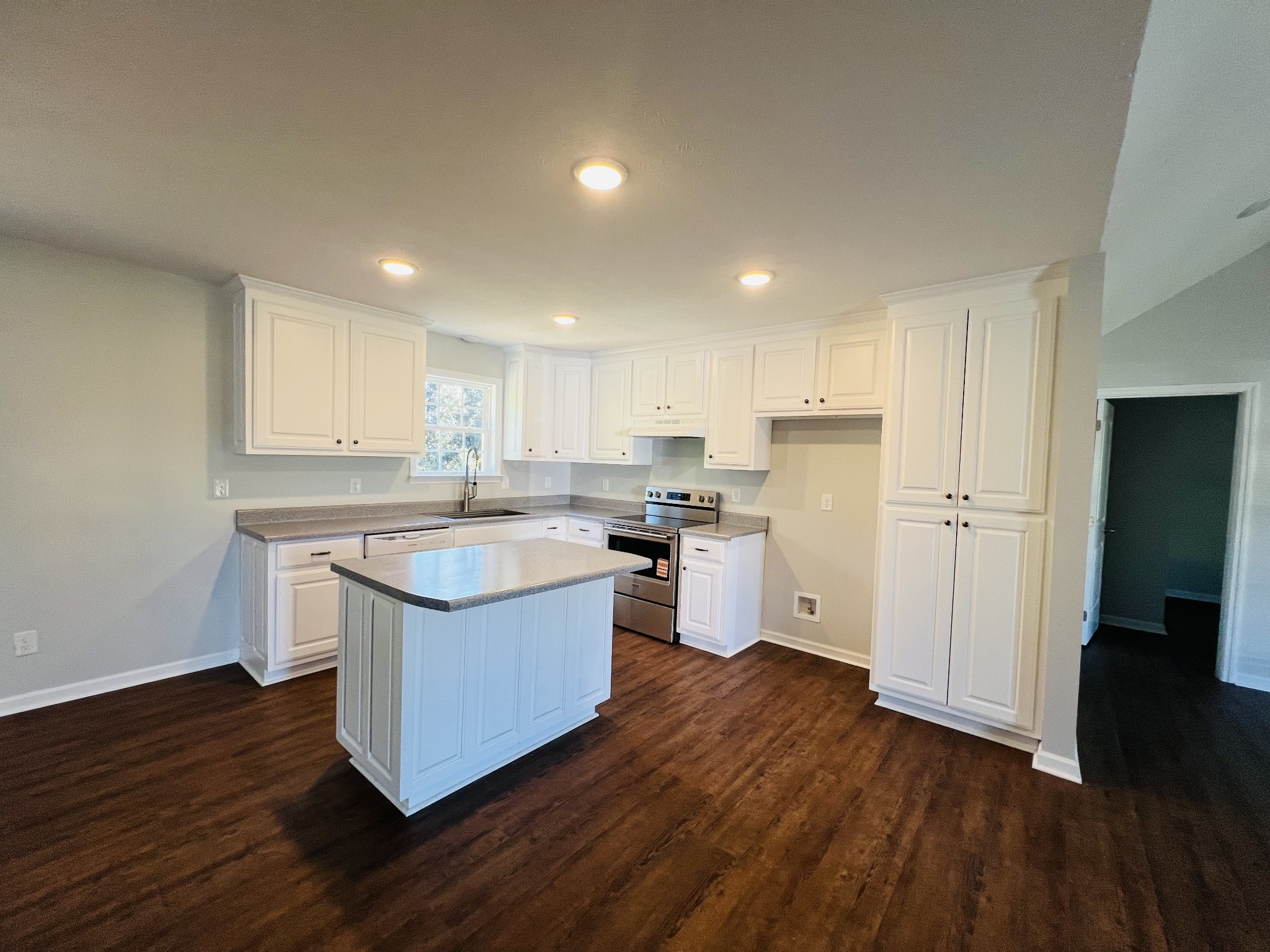 60 Myrick Road Flintville, TN 37335 - Photo 16 of 32 a kitchen with stainless steel appliances granite countertop a sink a stove a refrigerator and white cabinets