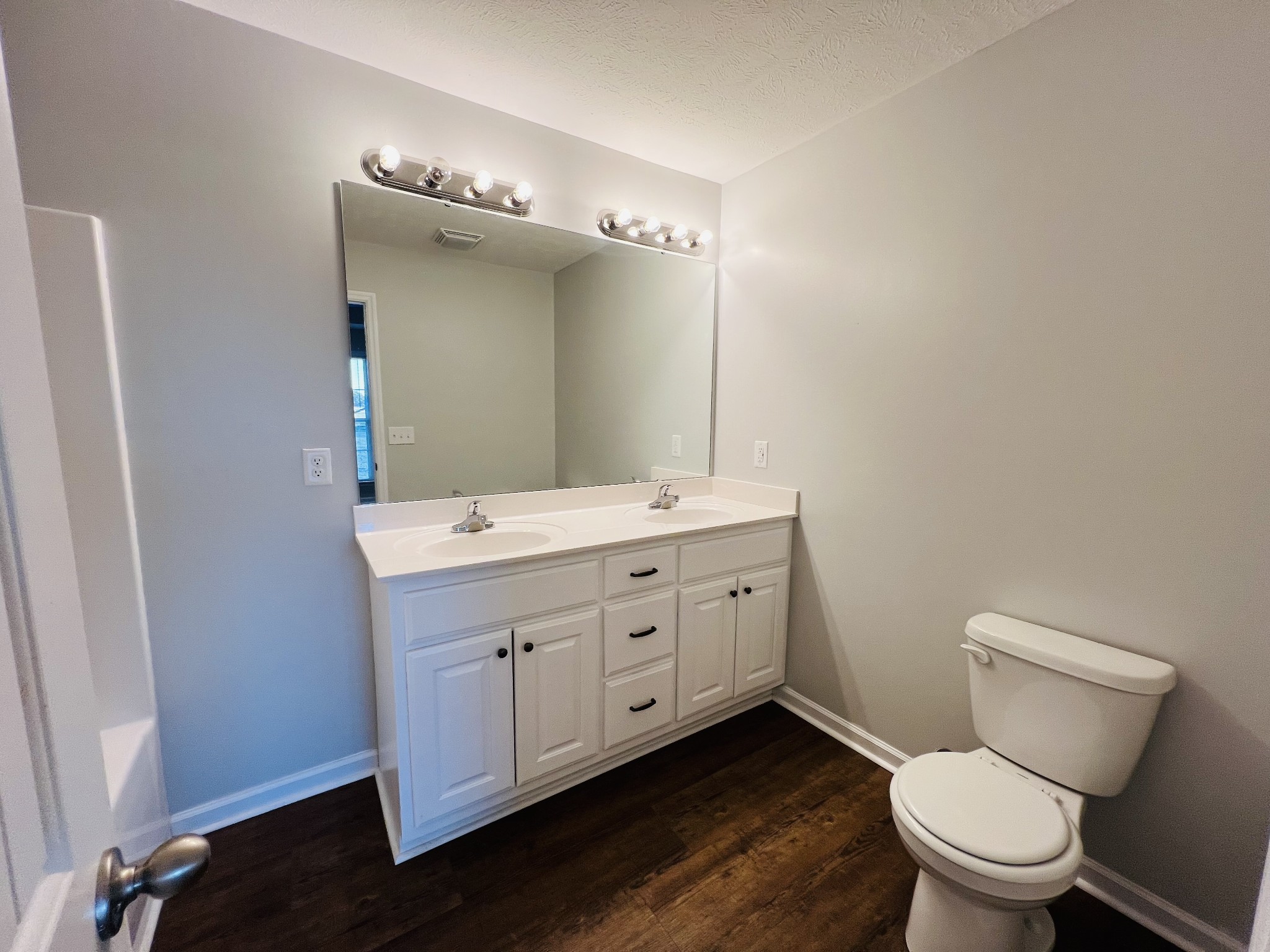 60 Myrick Road Flintville, TN 37335 - Photo 19 of 32 a bathroom with a double vanity sink mirror and toilet