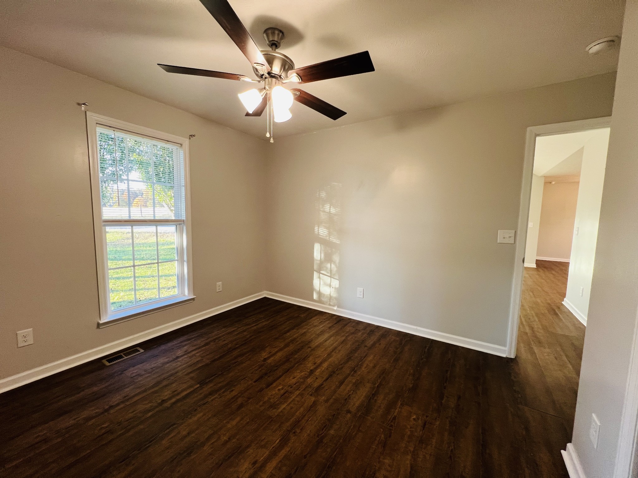 60 Myrick Road Flintville, TN 37335 - Photo 25 of 32 a view of an empty room with wooden floor and a window