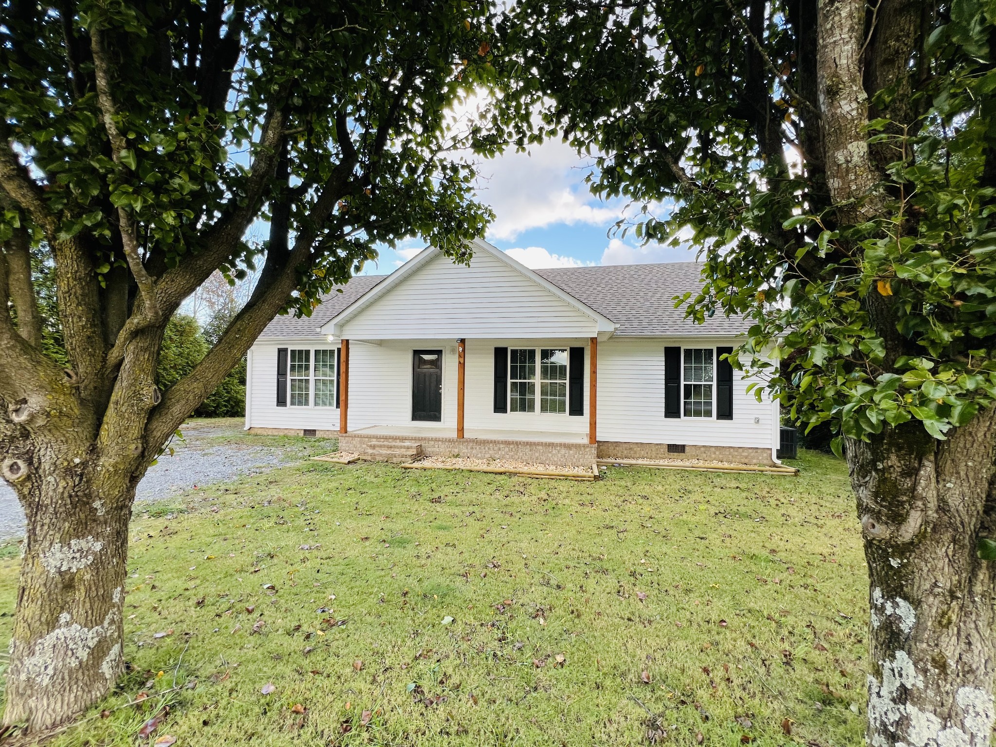 60 Myrick Road Flintville, TN 37335 - Photo 31 of 32 a white house that has a tree in front of it