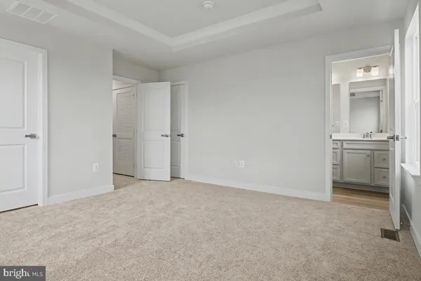 a view of an empty room with a fireplace