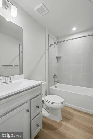 a bathroom with a sink a toilet and a bathtub