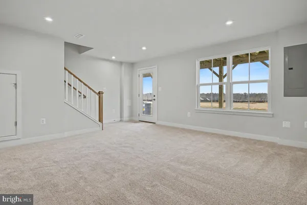 a view of an empty room with stairs