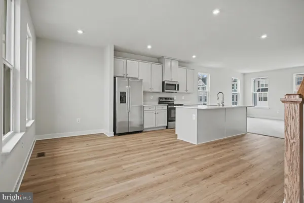 a view of kitchen with wooden floor
