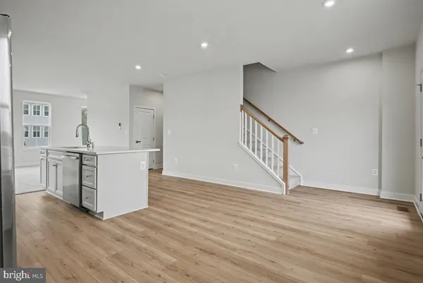 a view of a kitchen with wooden floor