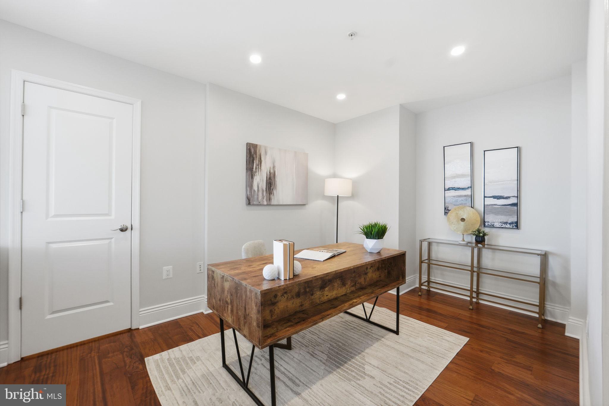 11990 Market Street, Unit 2103 Reston, VA 20190 - Photo 21 of 78 Modern workspace with warm accents.