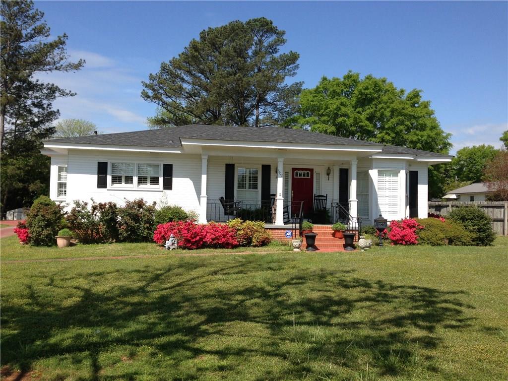 607 North Main Street Cedartown, GA 30125 - Photo 1 of 1 a front view of house with yard outdoor seating and green space