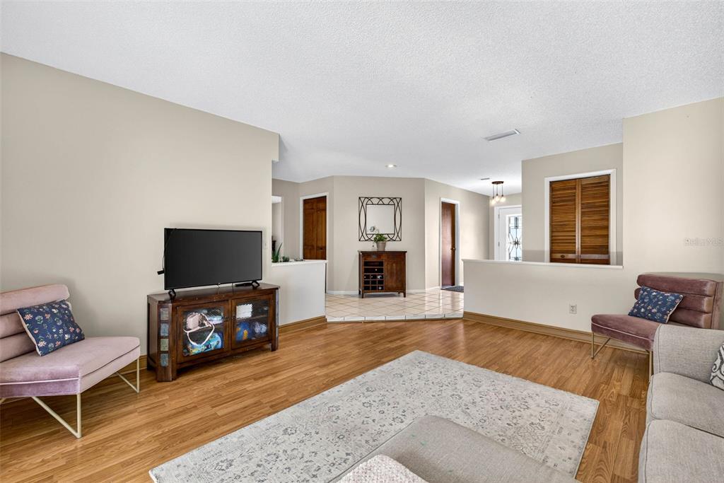 12913 Rain Forest Street Temple Terrace, FL 33617 - Photo 14 of 63 a living room with furniture and a flat screen tv