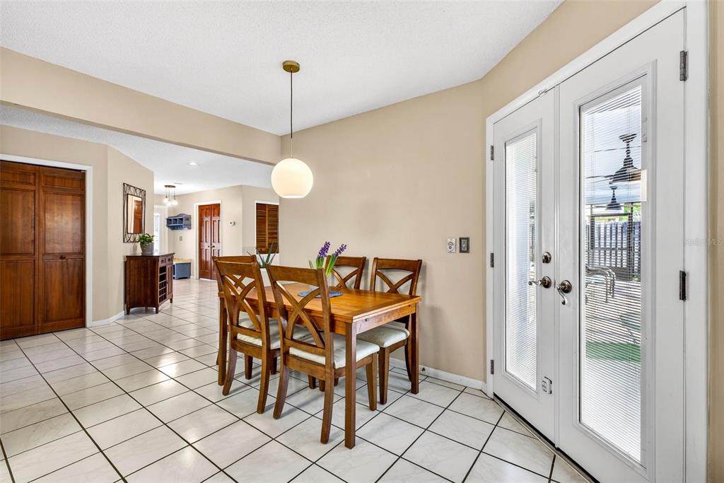 12913 Rain Forest Street Temple Terrace, FL 33617 - Photo 19 of 63 a view of a dining room with furniture and a chandelier