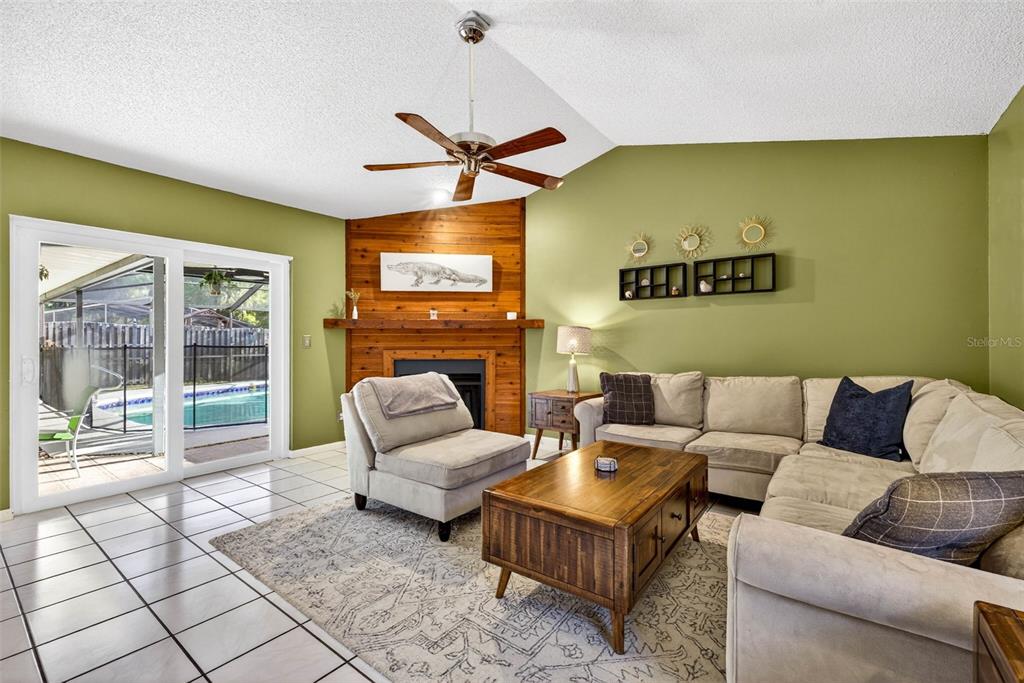 12913 Rain Forest Street Temple Terrace, FL 33617 - Photo 22 of 63 a living room with furniture and a flat screen tv