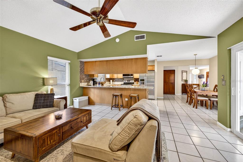 12913 Rain Forest Street Temple Terrace, FL 33617 - Photo 23 of 63 a living room with furniture and kitchen view