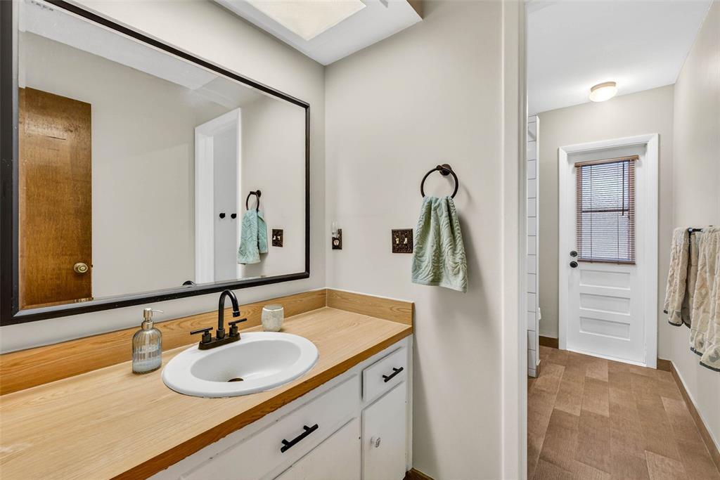 12913 Rain Forest Street Temple Terrace, FL 33617 - Photo 41 of 63 a bathroom with a sink and a mirror
