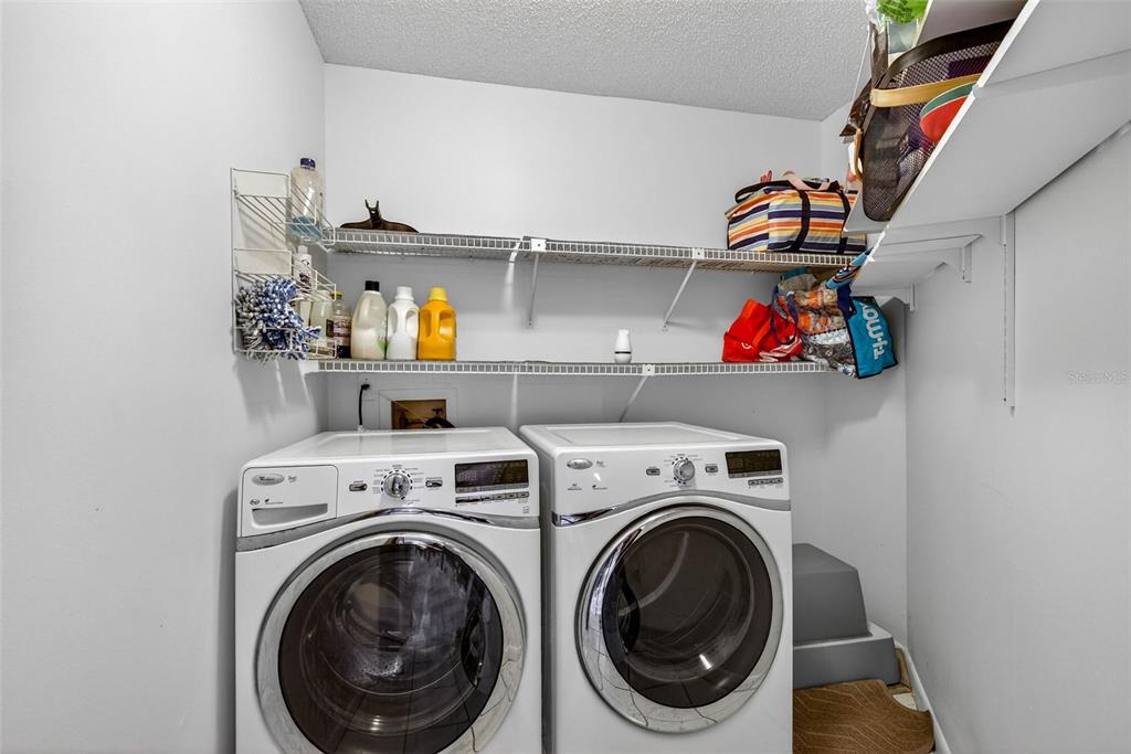 12913 Rain Forest Street Temple Terrace, FL 33617 - Photo 51 of 63 a utility room with dryer and washer