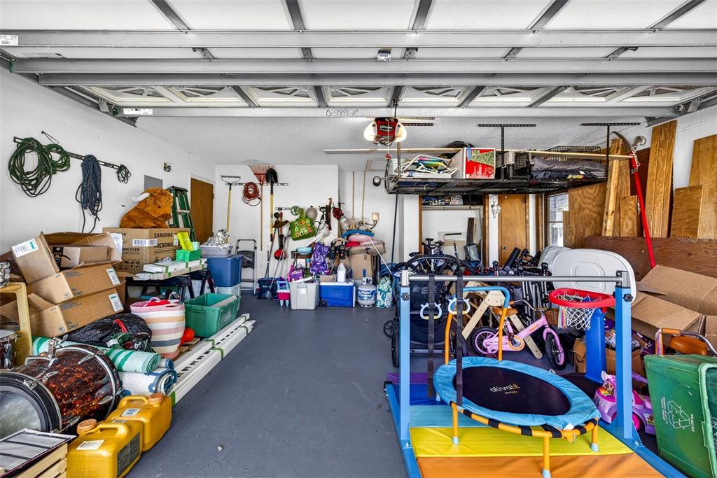 12913 Rain Forest Street Temple Terrace, FL 33617 - Photo 52 of 63 a storage room filled with lots of furniture and a water heater