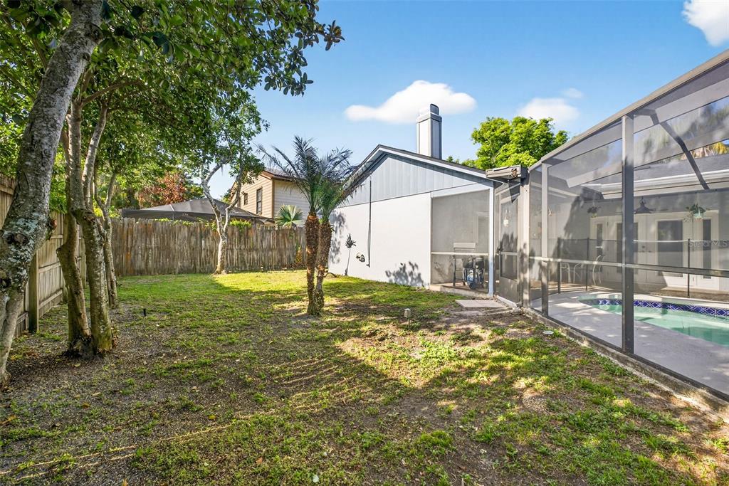12913 Rain Forest Street Temple Terrace, FL 33617 - Photo 59 of 63 a view of a backyard with a garden