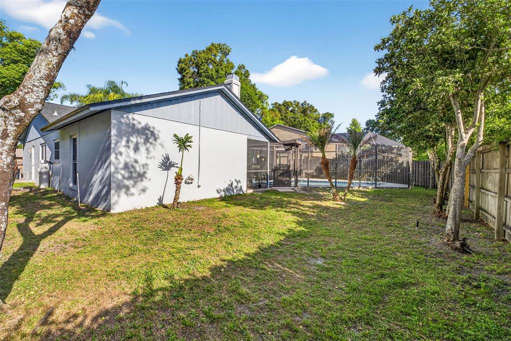 12913 Rain Forest Street Temple Terrace, FL 33617 - Photo 60 of 63 a house view with swimming pool in front of it