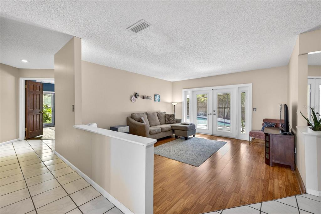 12913 Rain Forest Street Temple Terrace, FL 33617 - Photo 10 of 63 a living room with furniture and a large window