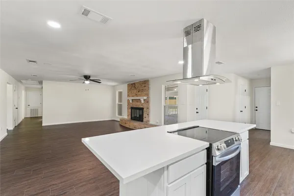 a kitchen with a stove and a refrigerator