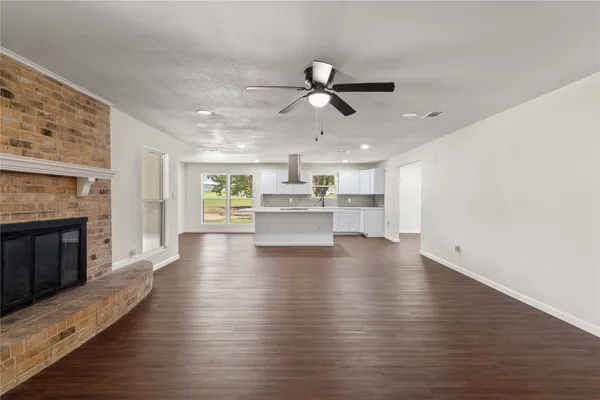 a view of a living room a fireplace with wooden floor
