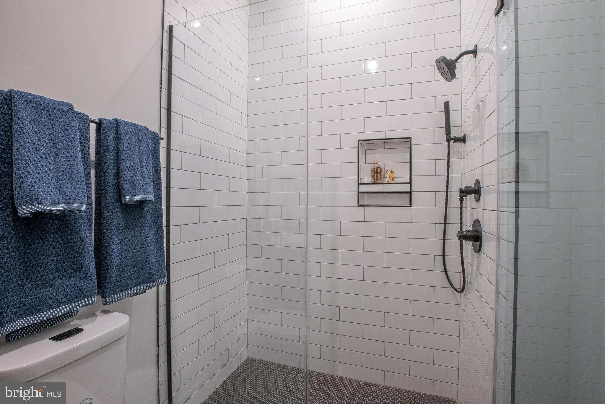 2940 West Thompson Street, Unit 305 Philadelphia, PA 19121 - Photo 14 of 24 a bathroom with a shower