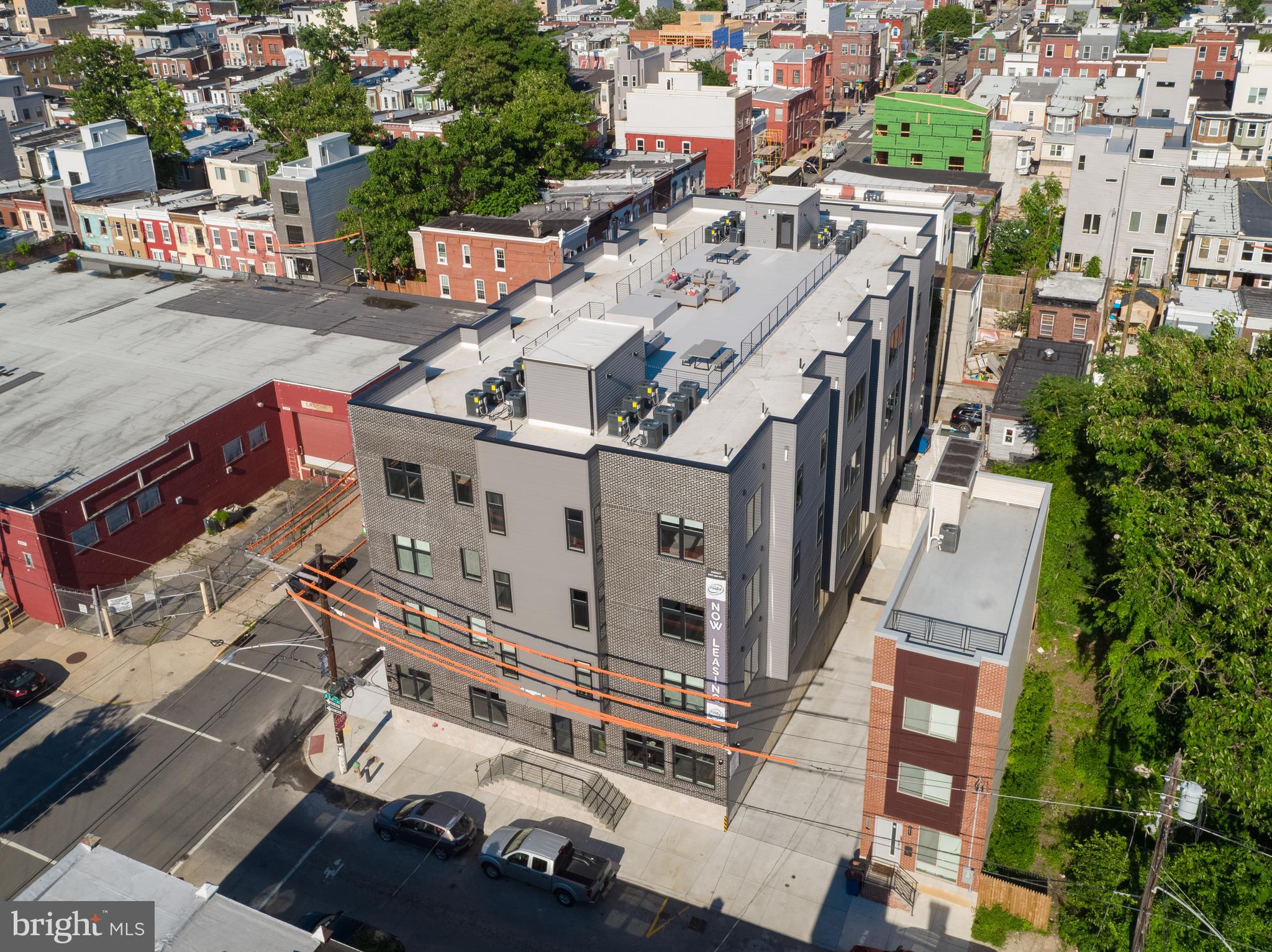 2940 West Thompson Street, Unit 305 Philadelphia, PA 19121 - Photo 19 of 24 an aerial view of residential houses with outdoor space