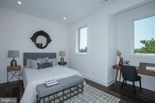 a bedroom with a bed and a chair