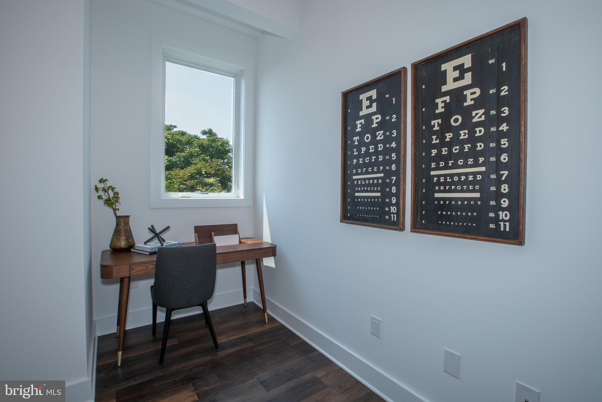 2940 West Thompson Street, Unit 305 Philadelphia, PA 19121 - Photo 10 of 24 a view of a workspace with furniture and a window