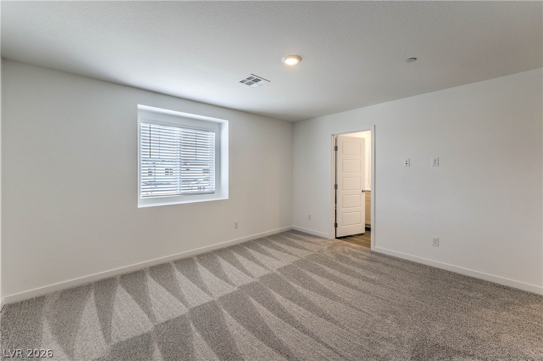 776 Fallen Phoenix Street Henderson, NV 89011 - Photo 11 of 30 Primary Bedroom features a Walk-in Closet and Bathroom with Dual Sinks and Shower
