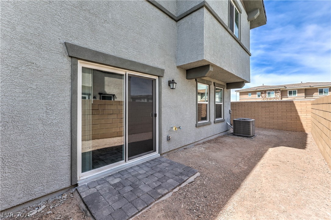 776 Fallen Phoenix Street Henderson, NV 89011 - Photo 22 of 30 Fully Fenced Rear Yard with BBQ Stub (Landlord is in the process of having a 10 x 12 Paver Patio, Synthetic Grass, Shrubs with Irrigation System, and Decorative Rock installed in Rear & Side Yards)