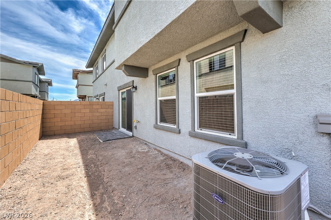 776 Fallen Phoenix Street Henderson, NV 89011 - Photo 23 of 30 Fully Fenced Rear Yard with BBQ Stub (Landlord is in the process of having a 10 x 12 Paver Patio, Synthetic Grass, Shrubs with Irrigation System, and Decorative Rock installed in Rear & Side Yards)