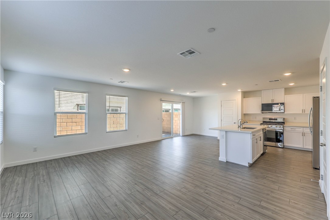 776 Fallen Phoenix Street Henderson, NV 89011 - Photo 3 of 30 Spacious Great Room with Luxury Vinyl Plank Flooring
