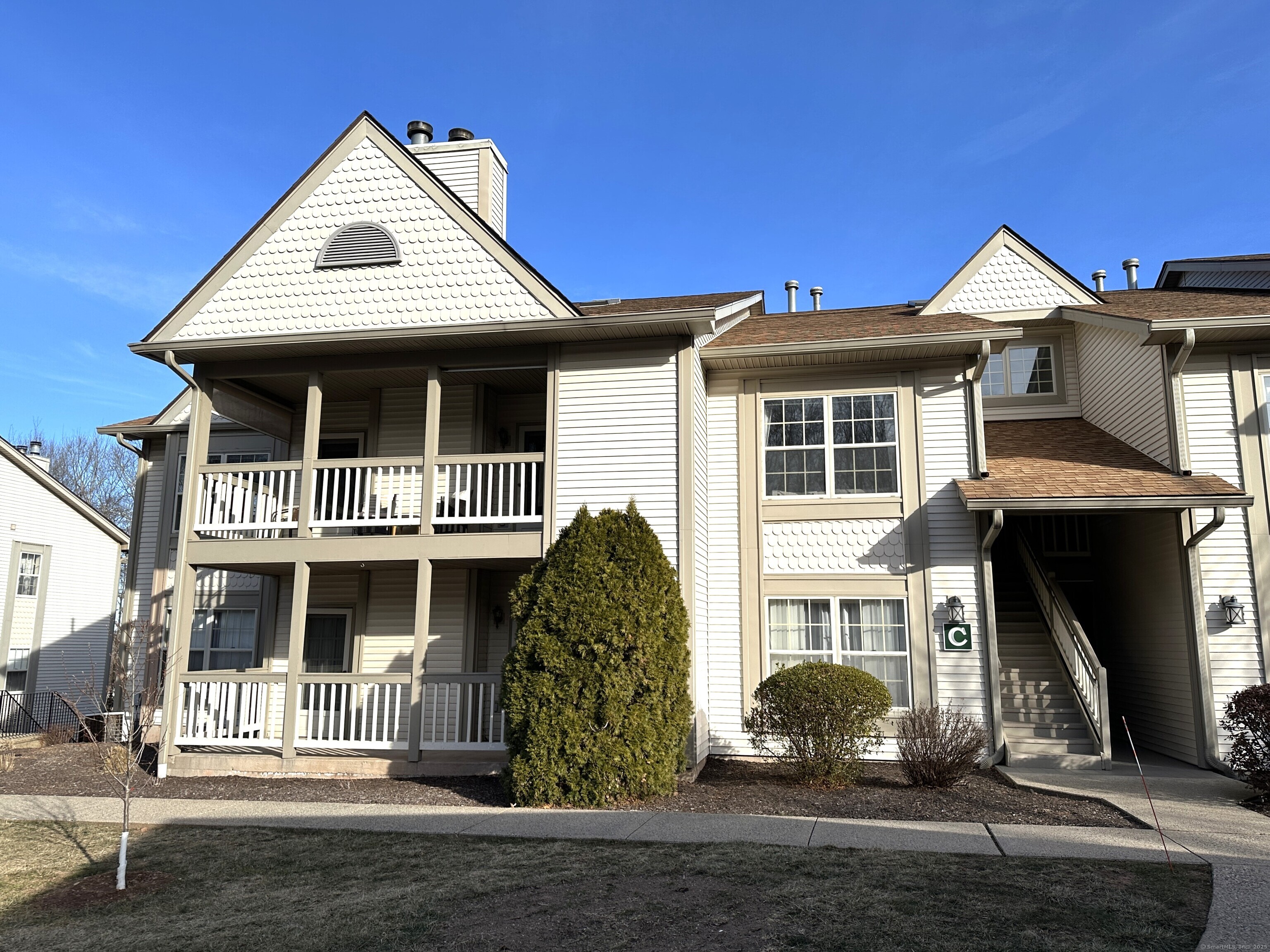 33 Langdon Court, Unit C201 Berlin, CT 06037 - Photo 1 of 1 a front view of a house with a yard