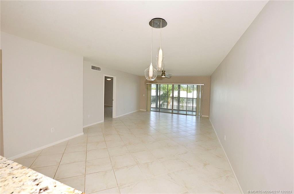 1866 Southwest Palm City Road, Unit 302 Stuart, FL 34994 - Photo 14 of 30 a view of an empty room and window