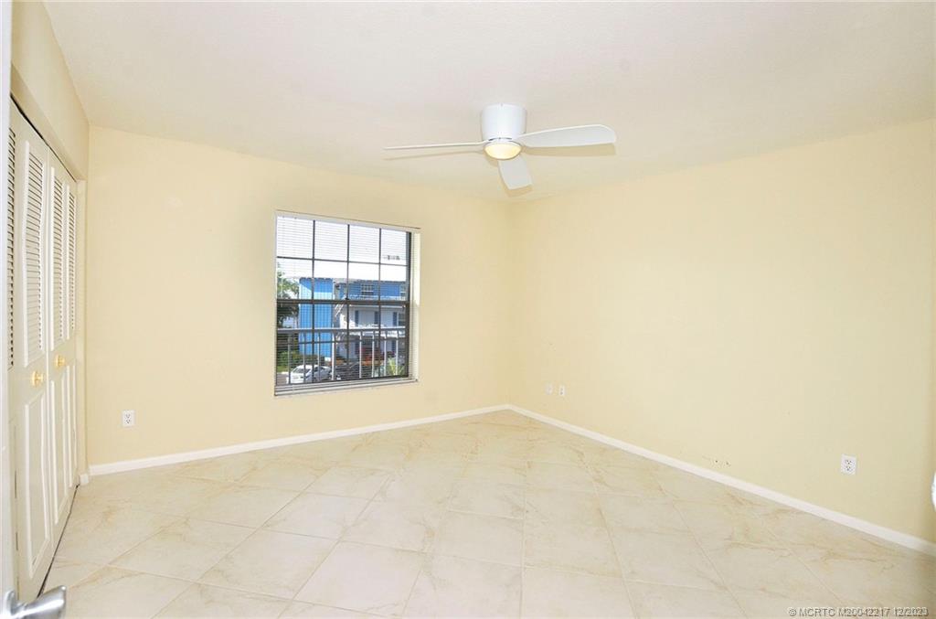 1866 Southwest Palm City Road, Unit 302 Stuart, FL 34994 - Photo 17 of 30 an empty room with windows