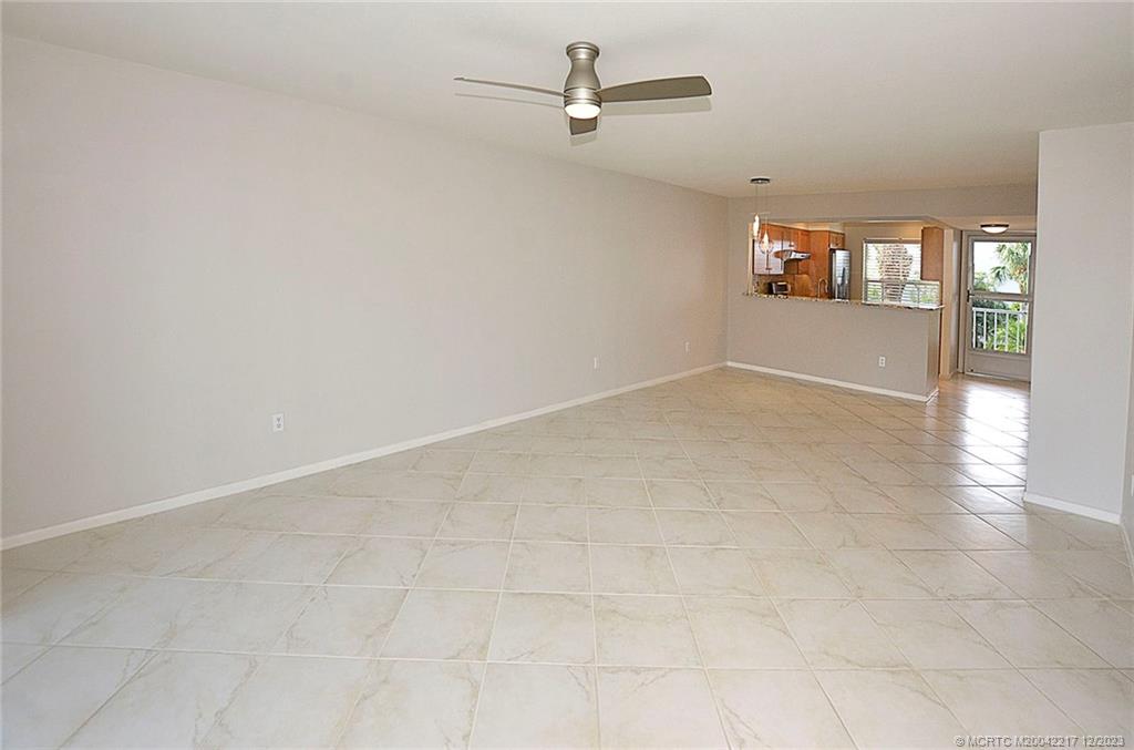 1866 Southwest Palm City Road, Unit 302 Stuart, FL 34994 - Photo 22 of 30 an empty room with windows and entrance