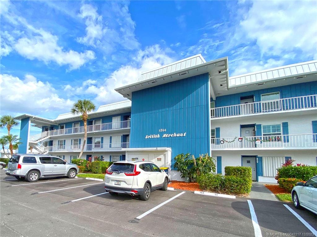 1866 Southwest Palm City Road, Unit 302 Stuart, FL 34994 - Photo 5 of 30 a car parked in front of a building