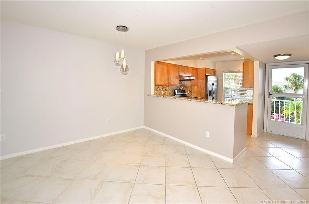 1866 Southwest Palm City Road, Unit 302 Stuart, FL 34994 - Photo 9 of 30 a view of a room with a large window