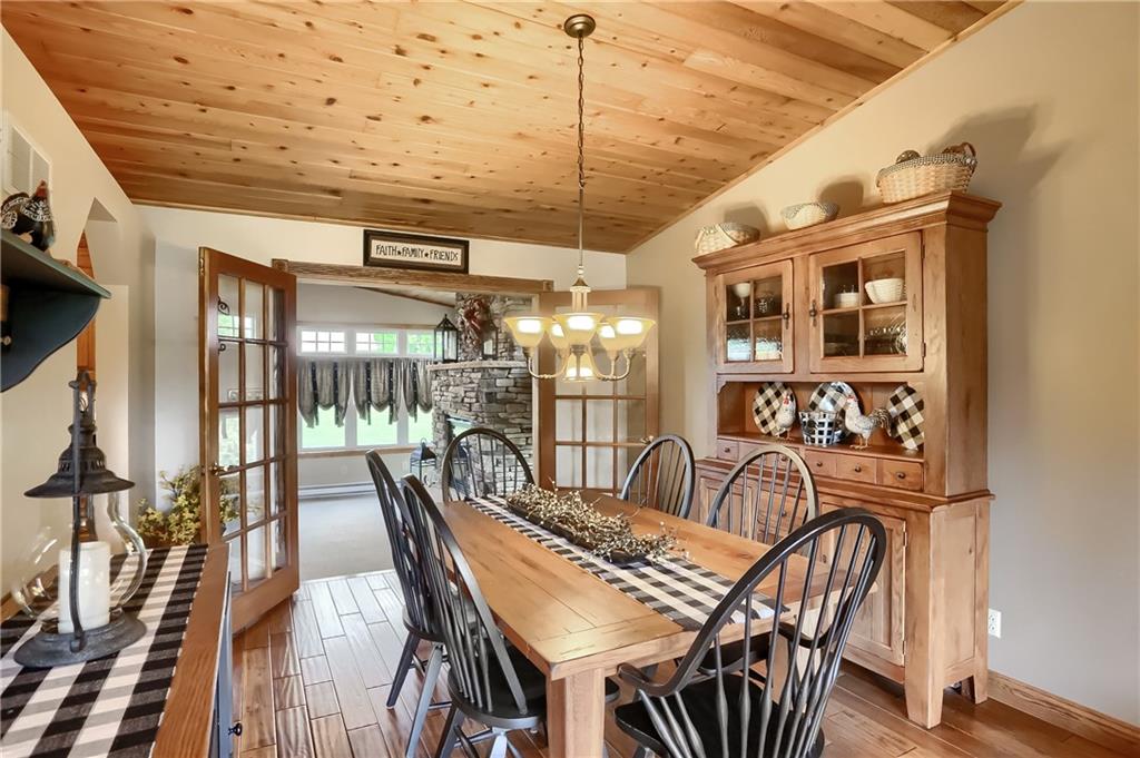 287 Holyoke Road Butler, PA 16001 - Photo 12 of 35 a view of a dining room with furniture wooden floor and a chandelier
