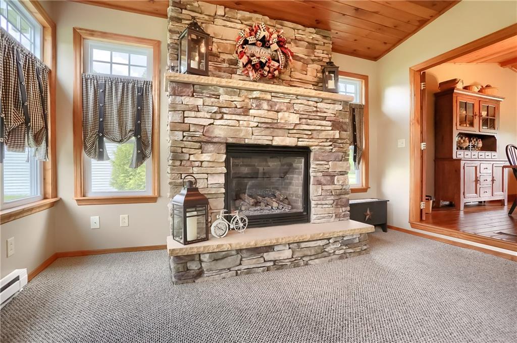 287 Holyoke Road Butler, PA 16001 - Photo 16 of 35 an empty room with windows and fireplace