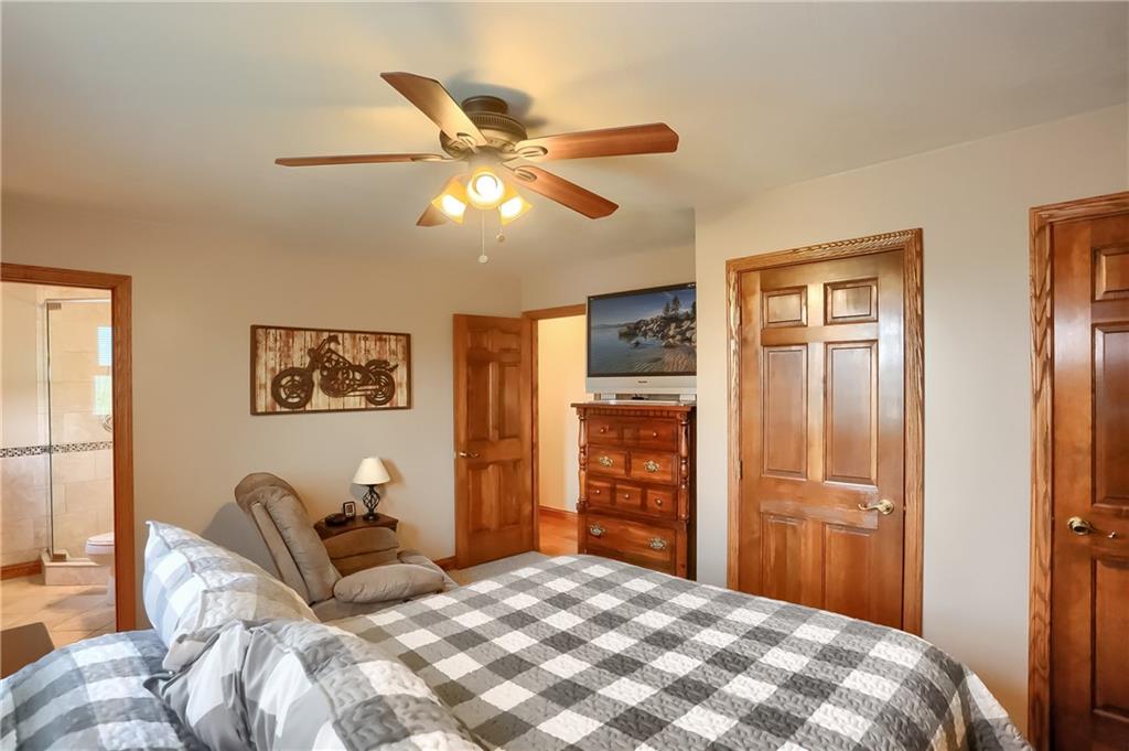 287 Holyoke Road Butler, PA 16001 - Photo 17 of 35 a bedroom with a bed and a chandelier