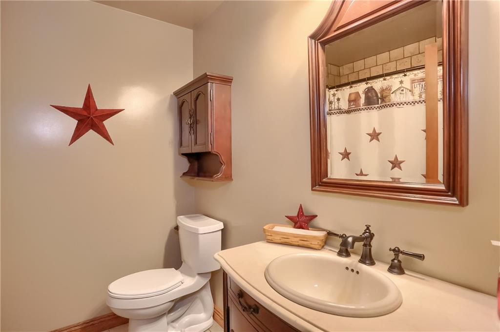 287 Holyoke Road Butler, PA 16001 - Photo 25 of 35 a bathroom with a toilet a sink and mirror