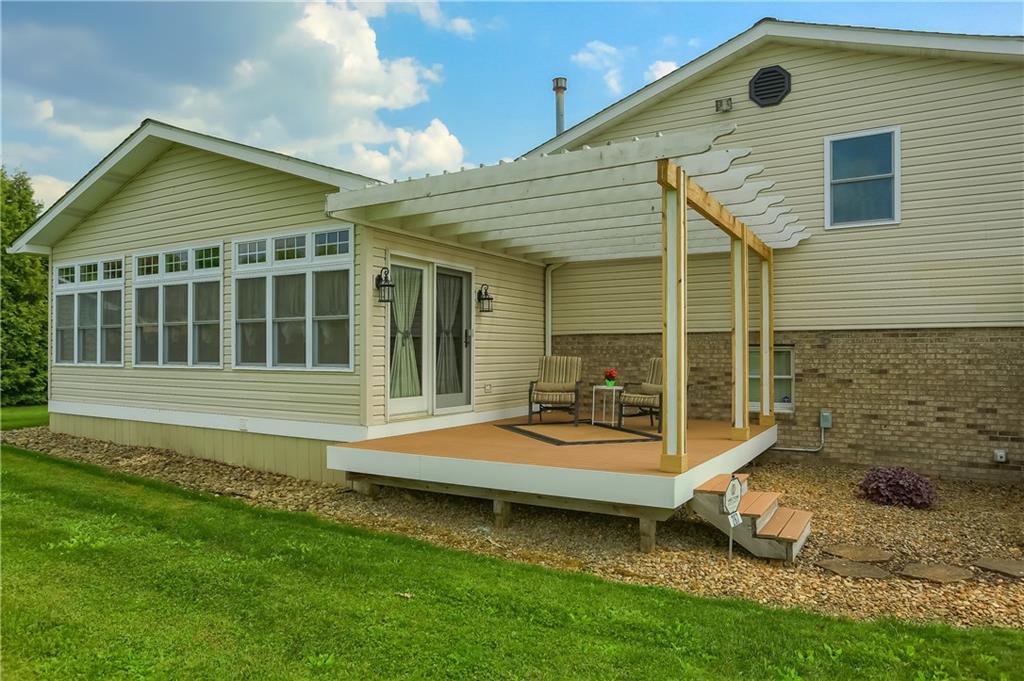 287 Holyoke Road Butler, PA 16001 - Photo 28 of 35 a backyard of a house with barbeque oven table and chairs