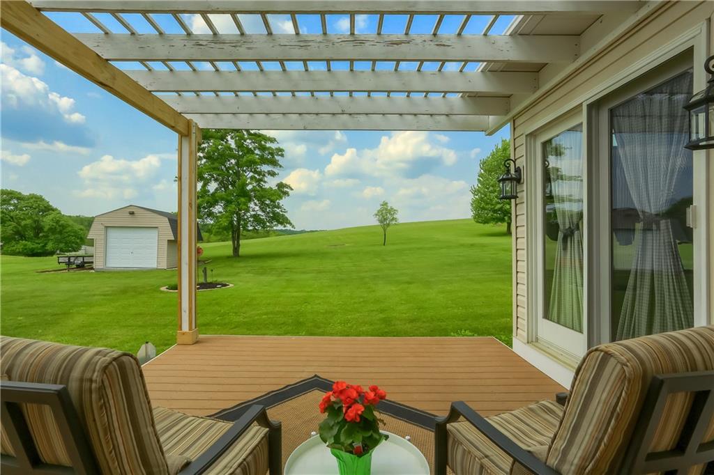 287 Holyoke Road Butler, PA 16001 - Photo 29 of 35 a view of a patio with a table chairs and a backyard