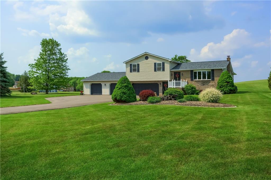 287 Holyoke Road Butler, PA 16001 - Photo 33 of 35 a front view of a house with garden