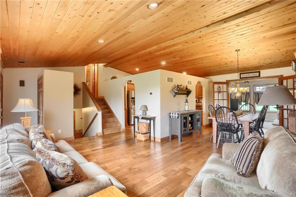 287 Holyoke Road Butler, PA 16001 - Photo 4 of 35 a living room with furniture and a dining table with wooden floor