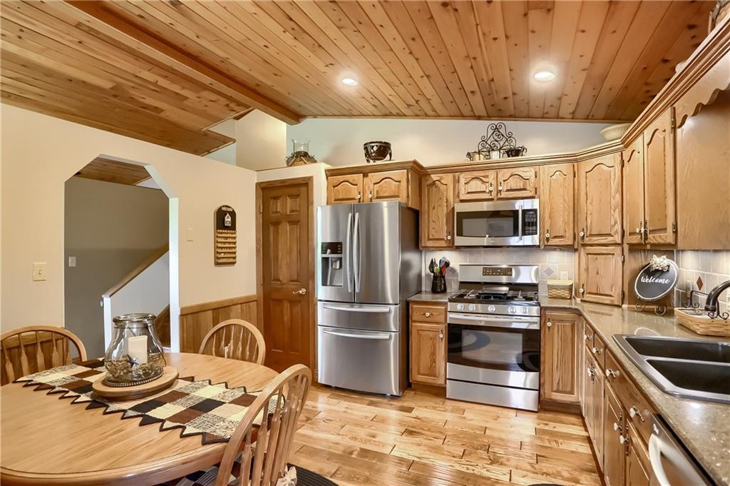 287 Holyoke Road Butler, PA 16001 - Photo 7 of 35 a kitchen with stainless steel appliances granite countertop a sink stove and refrigerator