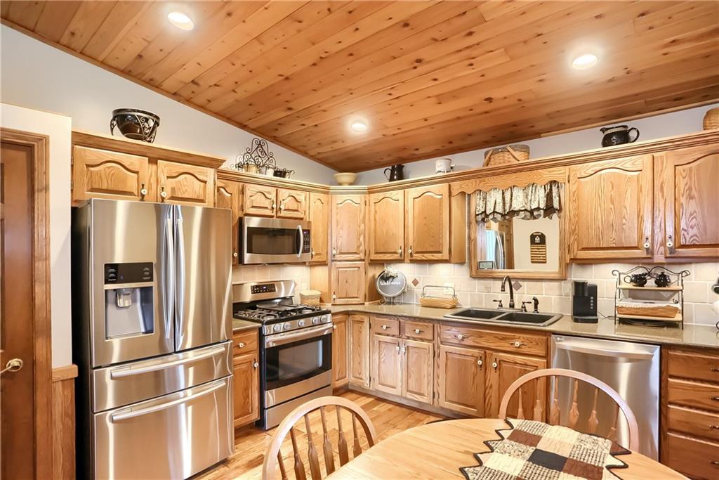 287 Holyoke Road Butler, PA 16001 - Photo 8 of 35 a kitchen with stainless steel appliances granite countertop a refrigerator and a stove top oven