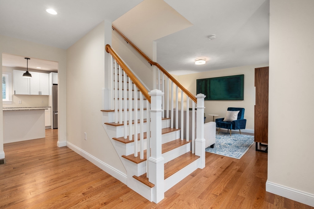 813 Chase Road Lunenburg, MA 01462 - Photo 17 of 41 a view of entryway and hall with wooden floor